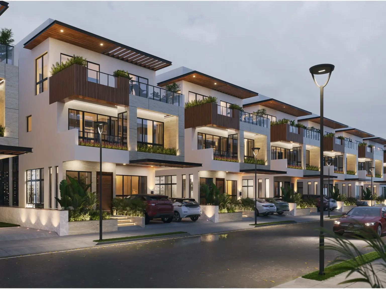 Modern luxury villas with glass balconies and warm exterior lighting