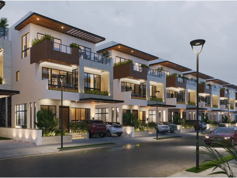 Modern luxury villas with glass balconies and warm exterior lighting
