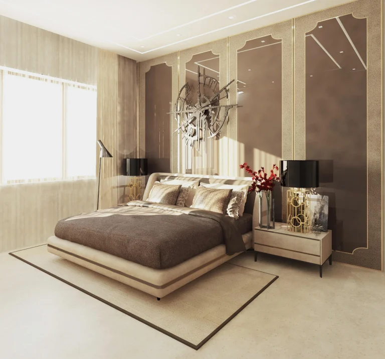 Luxury contemporary bedroom with a beige upholstered bed, warm neutral tones, mirrored wall panels, gold accents, modern bedside tables, and elegant decorative lighting.